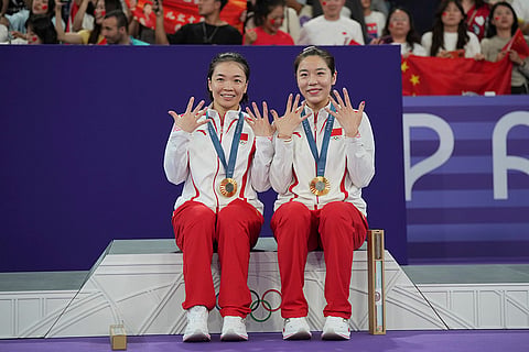 Badminton Women's doubles: China's Chen Qingchen, left, and Jia Yifan after winning gold medal